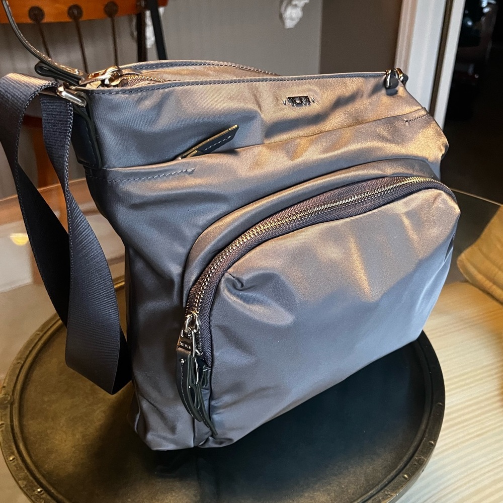 Tumi crossbody silver